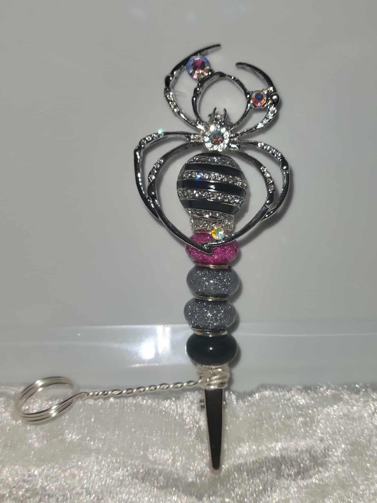 "Webbed Glamour: Handcrafted Spider-Themed Smoking Clip with Sparkling Elegance"