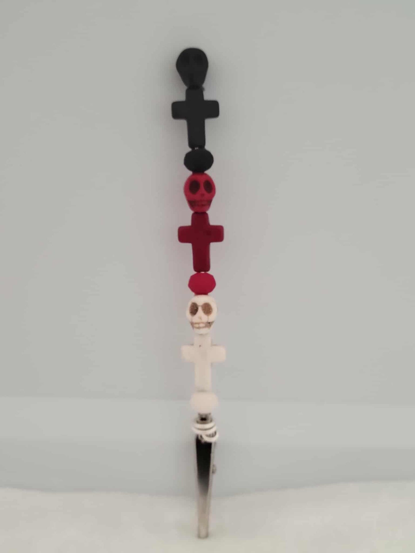 Decorative joint holder. Bone-chic roach clip. Stacked with skull beads and matching cross charms in black, red, and white