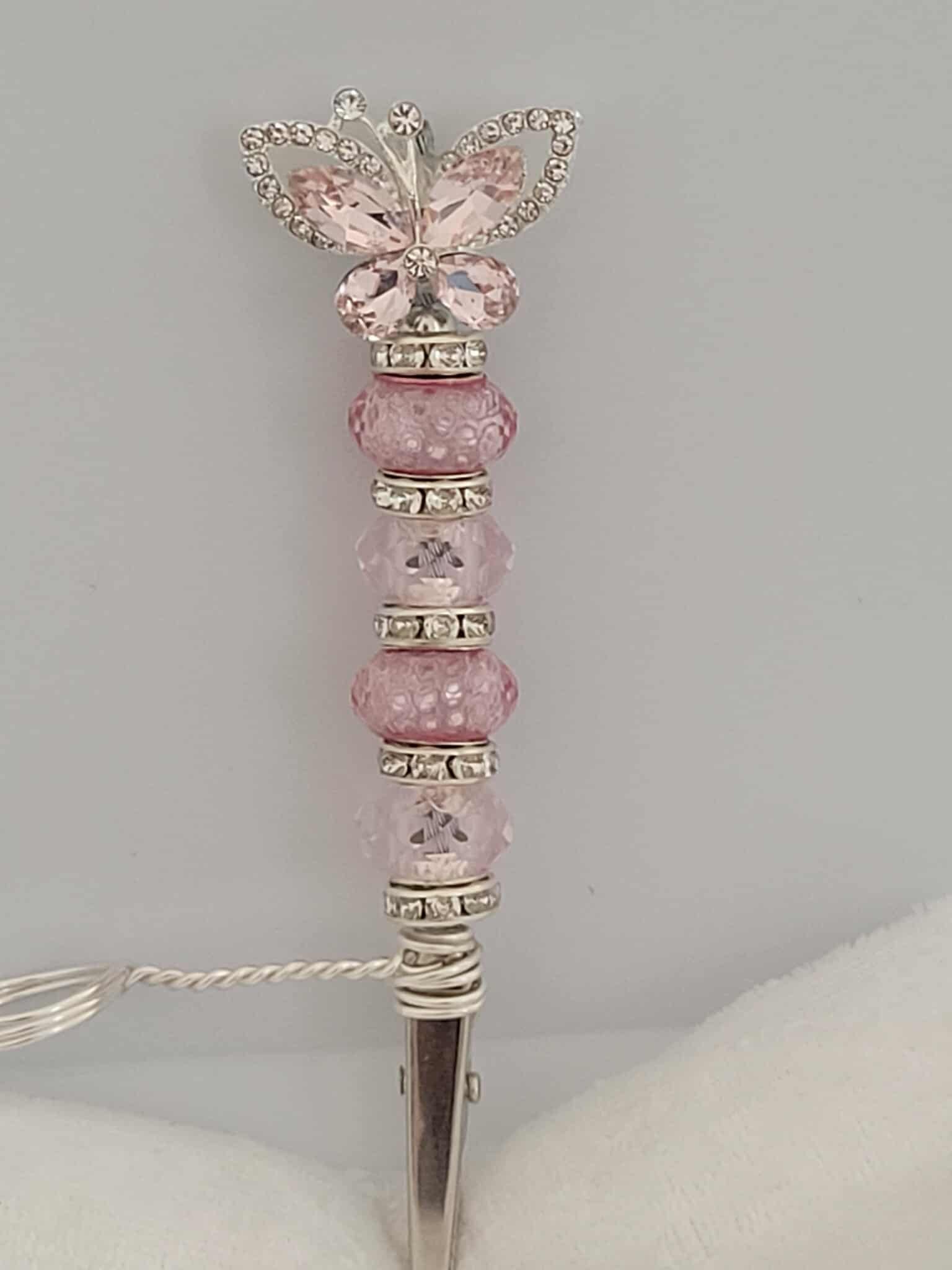 Decorative joint holder. Pink and silver butterfly roach clip. With pink and pink blush beads with small silver rhinestone spacers.