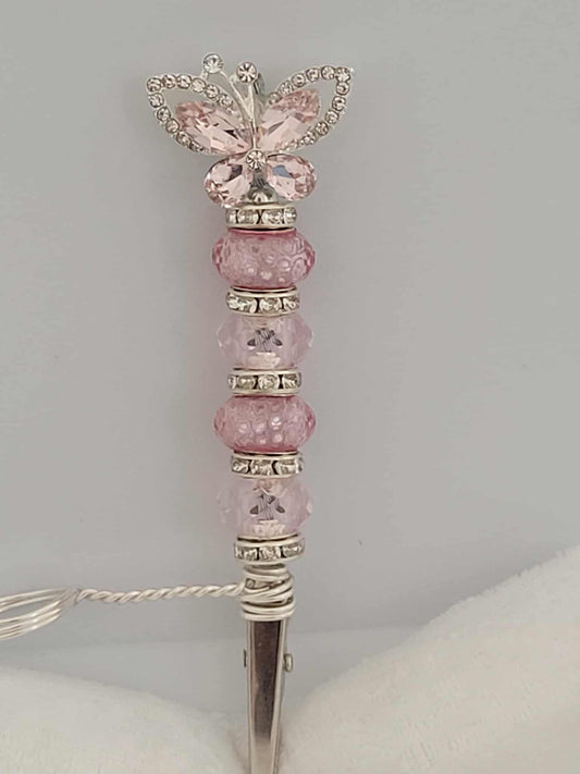 Decorative joint holder. Pink and silver butterfly roach clip. With pink and pink blush beads with small silver rhinestone spacers.