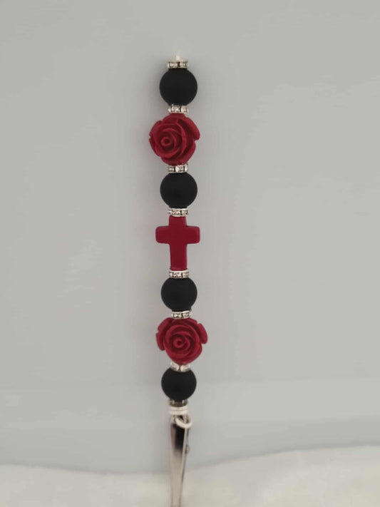 Decorative joint holder: Joint holder featuring matte black beads, crimson roses, shimmering rhinestone spacers, and a blood-red cross centerpiece.