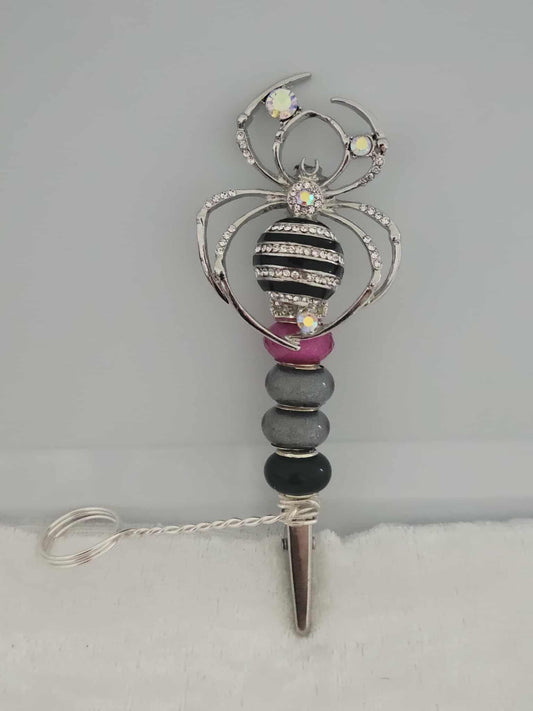 "Webbed Glamour: Handcrafted Spider-Themed Smoking Clip with Sparkling Elegance"